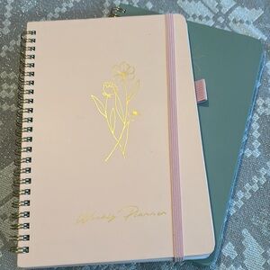 Daily planner and budget book. Never used brand new. Planner has a few scuffs